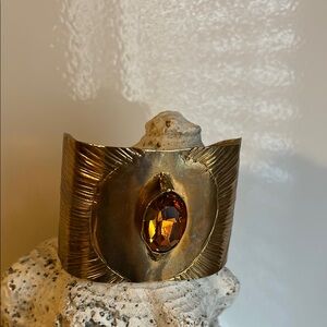 Add warmth and vibrancy with the Copper Cuff Bracelet with Amber crystal stone